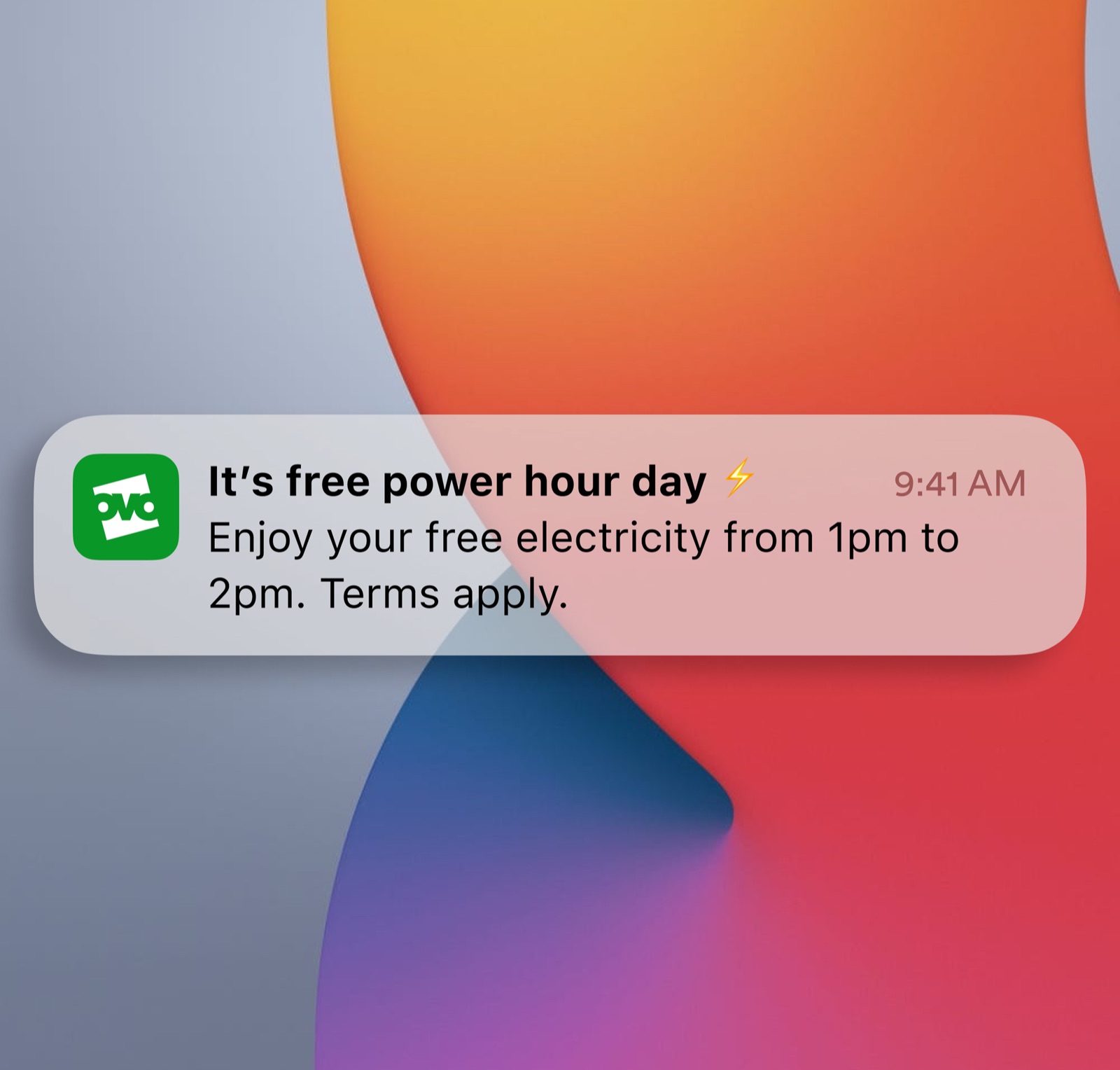 A lock screen notification: 'It's free power hour day — enjoy your free electricity from 1pm to 2pm.'